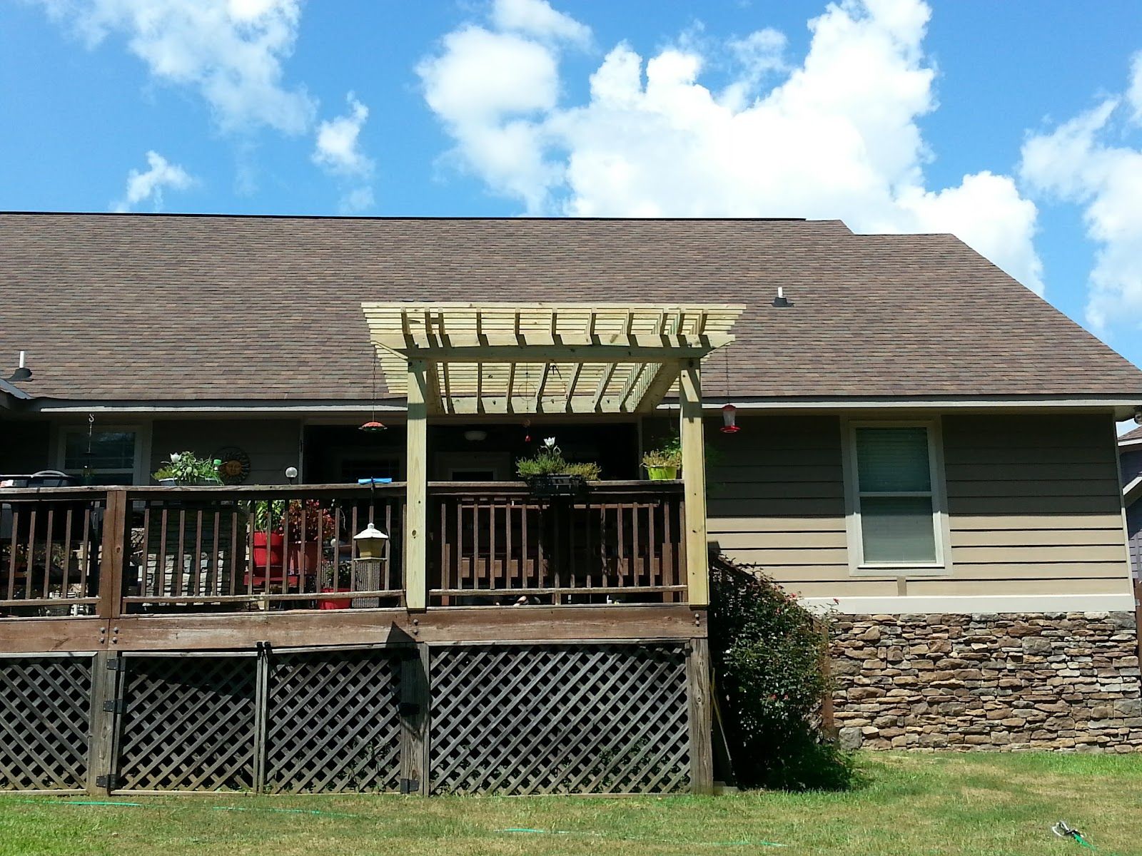 Raised deck with pergola on a home exterior