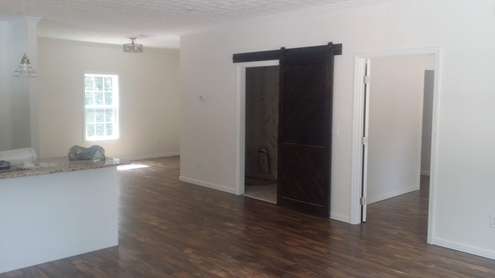 Remodeled open living area with new flooring