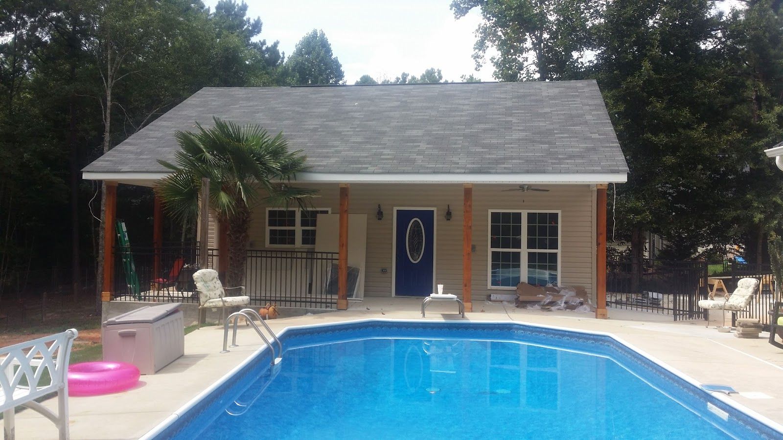 Pool house exterior beside a pool