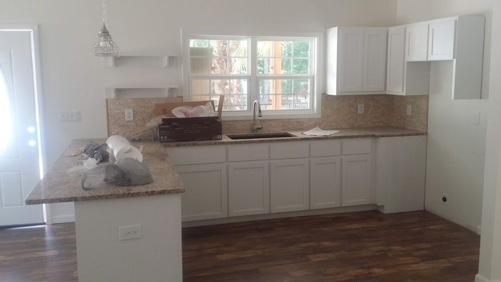 Remodeled kitchen with white cabinets
