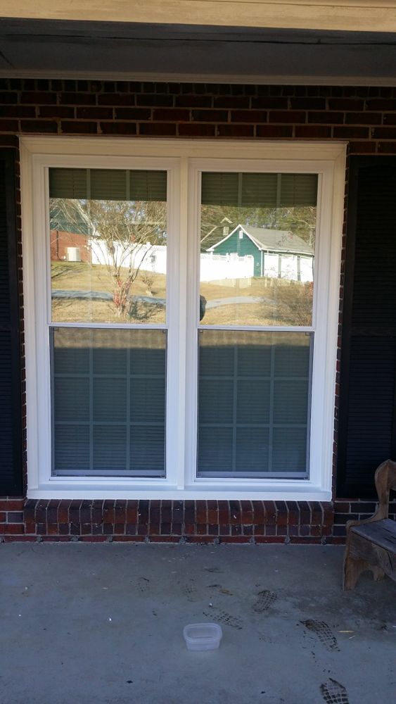 New double window on a brick home